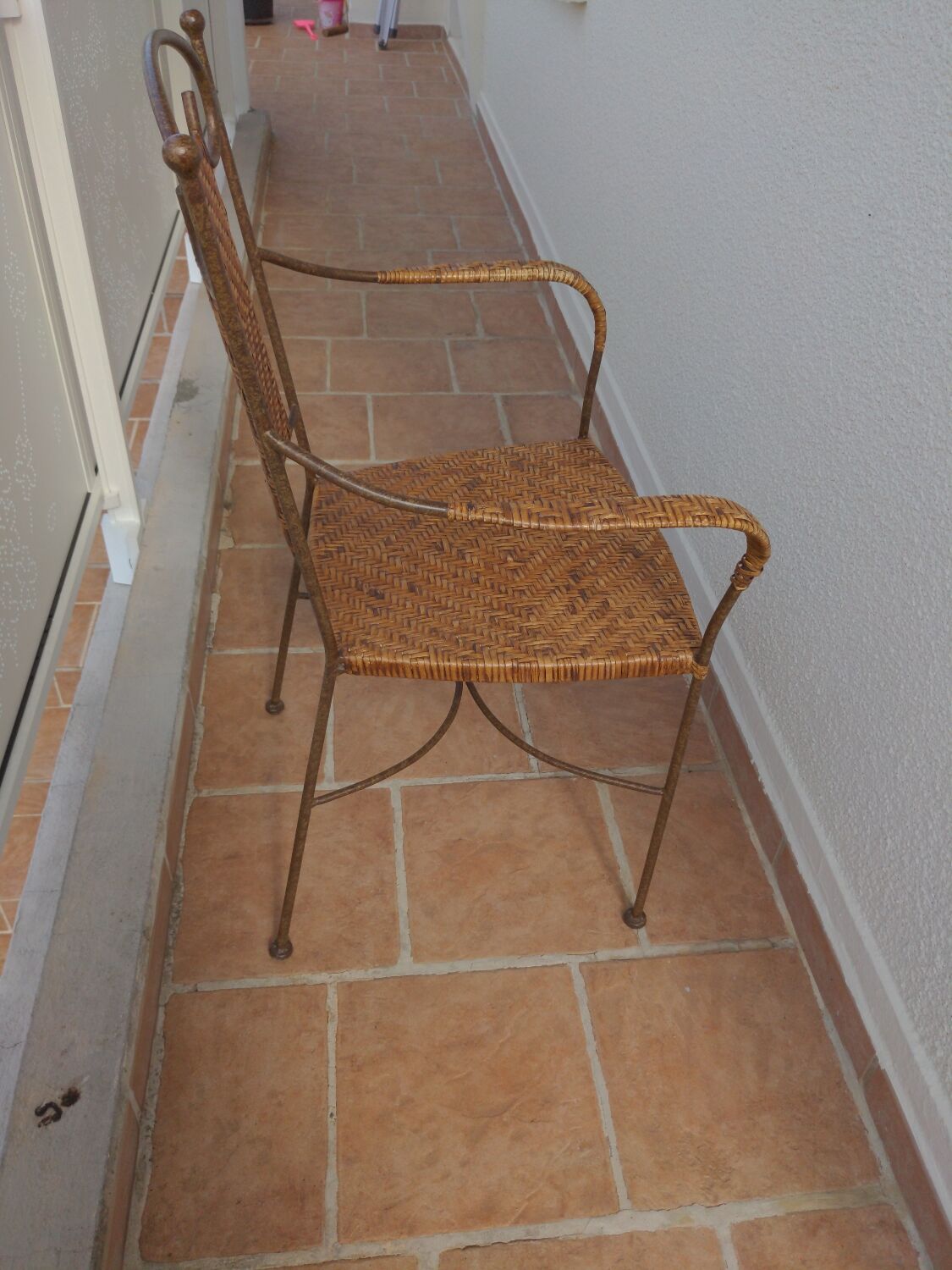 Wicker armchair and wrought iron