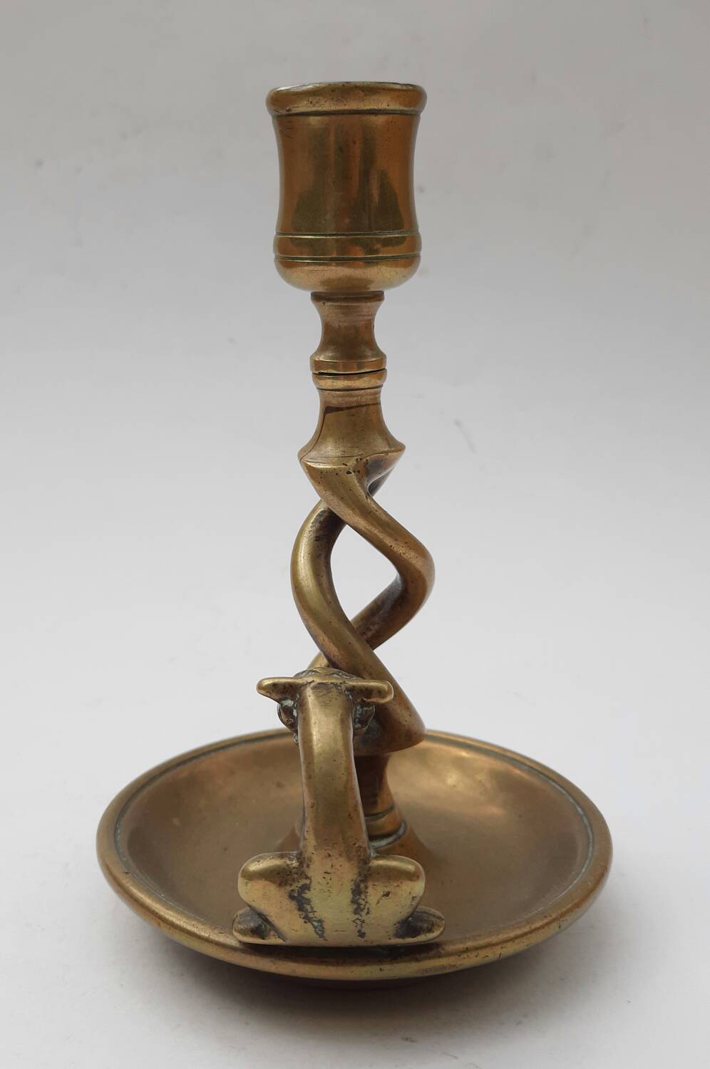 Antique bronze candlestick with dragon-shaped handle from the 17th century