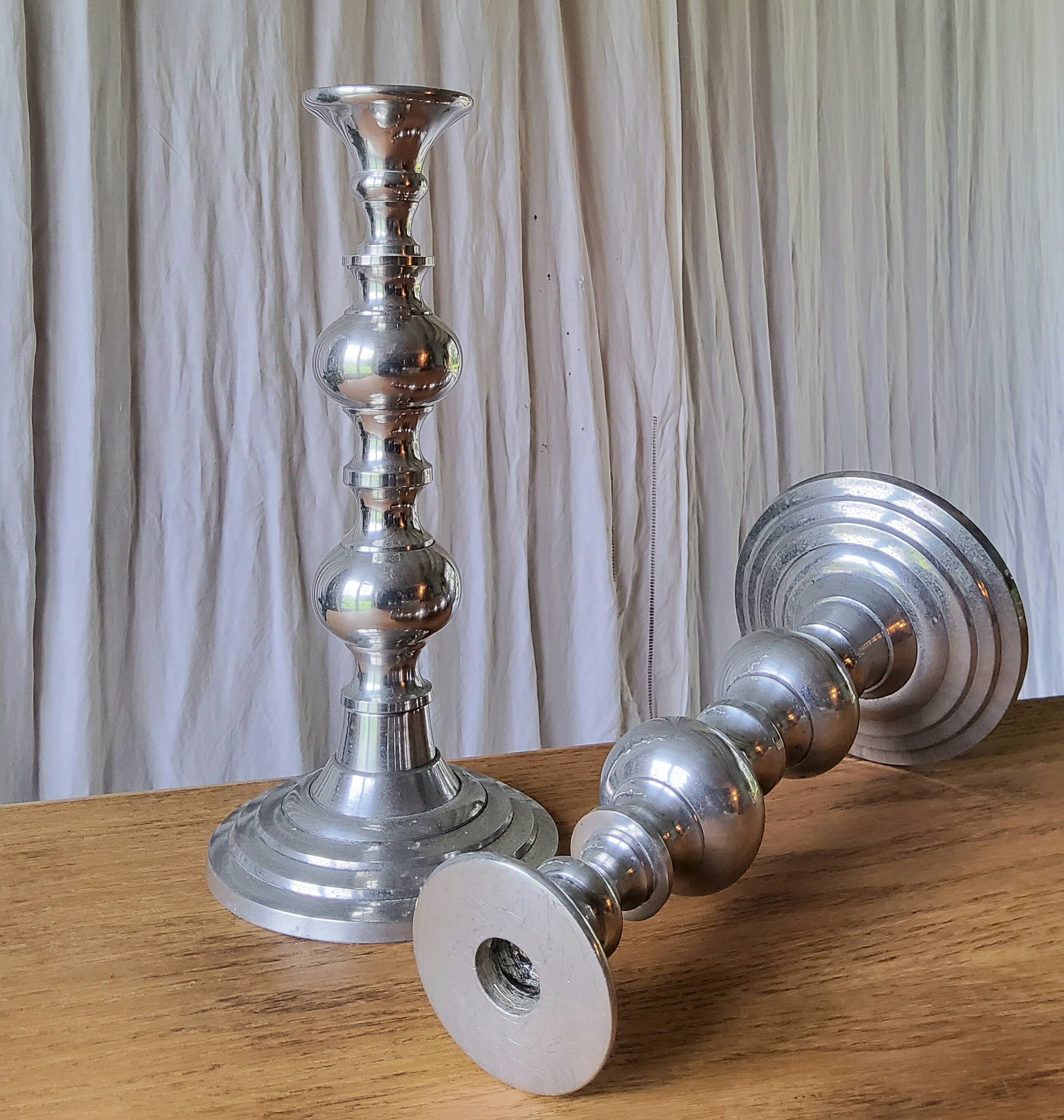 Pair of antique chrome metal candlesticks