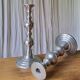 Pair of antique chrome metal candlesticks