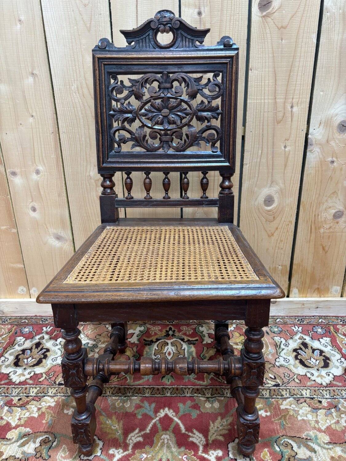 6 High Era chairs in carved solid oak and rattan caning.