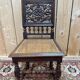 6 High Era chairs in carved solid oak and rattan caning.