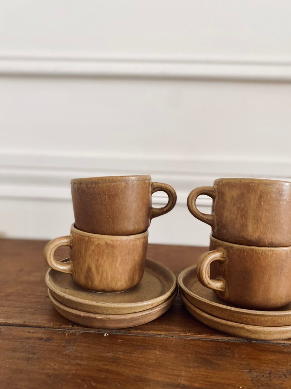 4 stoneware coffee cups and saucers
