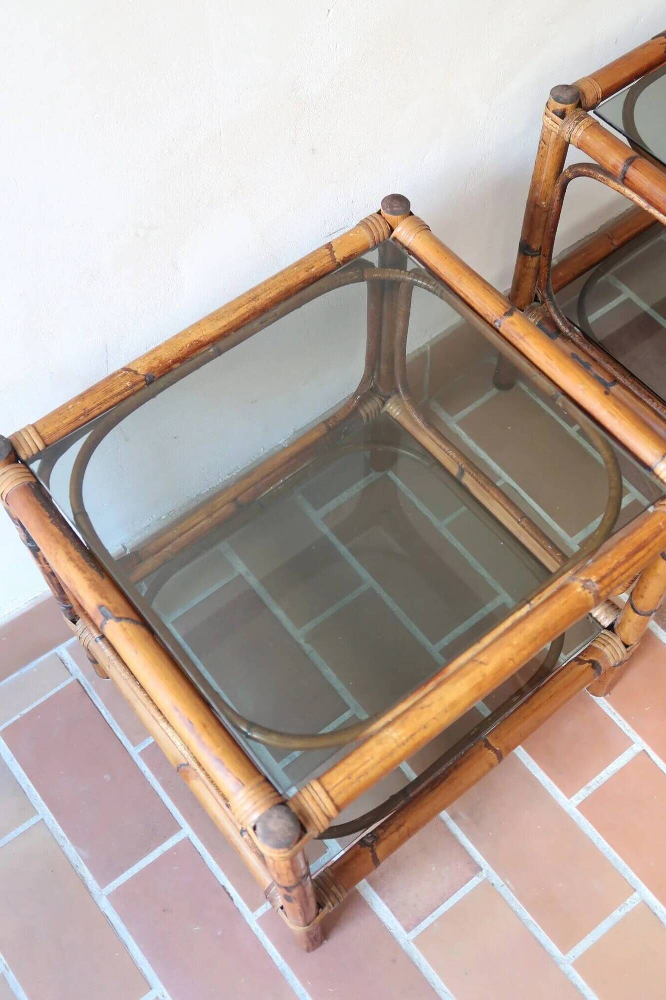 Pair of bamboo and rattan bedside tables, smoked glass tops.