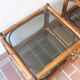 Pair of bamboo and rattan bedside tables, smoked glass tops.