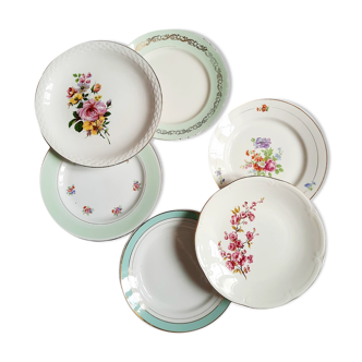 Flat antique earthenware plates with gilded edges