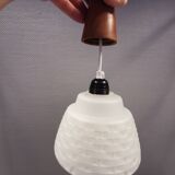 Lamp in white glass with teak top. It is Danish and estimated from the 1970s-1980s.