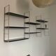 Vintage wall shelves in gold and black metal