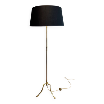 Brass floor lamp with a tripod base and claw feet from Maison Jansen.