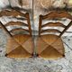 Pair of Rustic Antique Turned Wood Chairs + Woven Straw Seat Wine