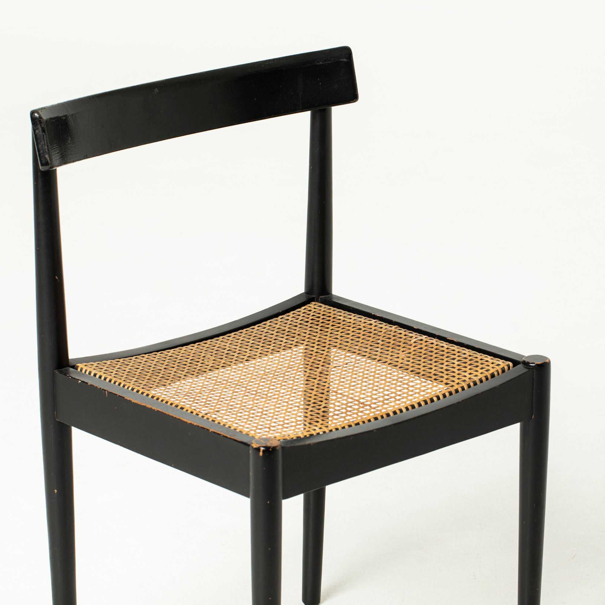 Mid-century dining chair in black laquered wood and cane