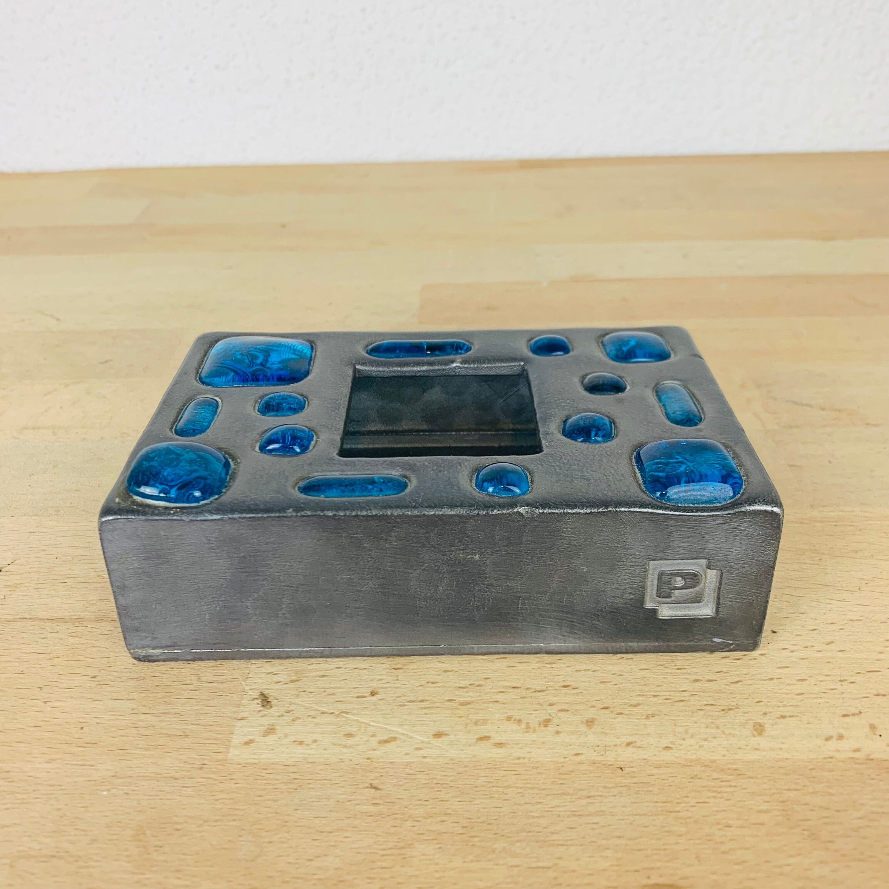 Decorative metal box and blue glass