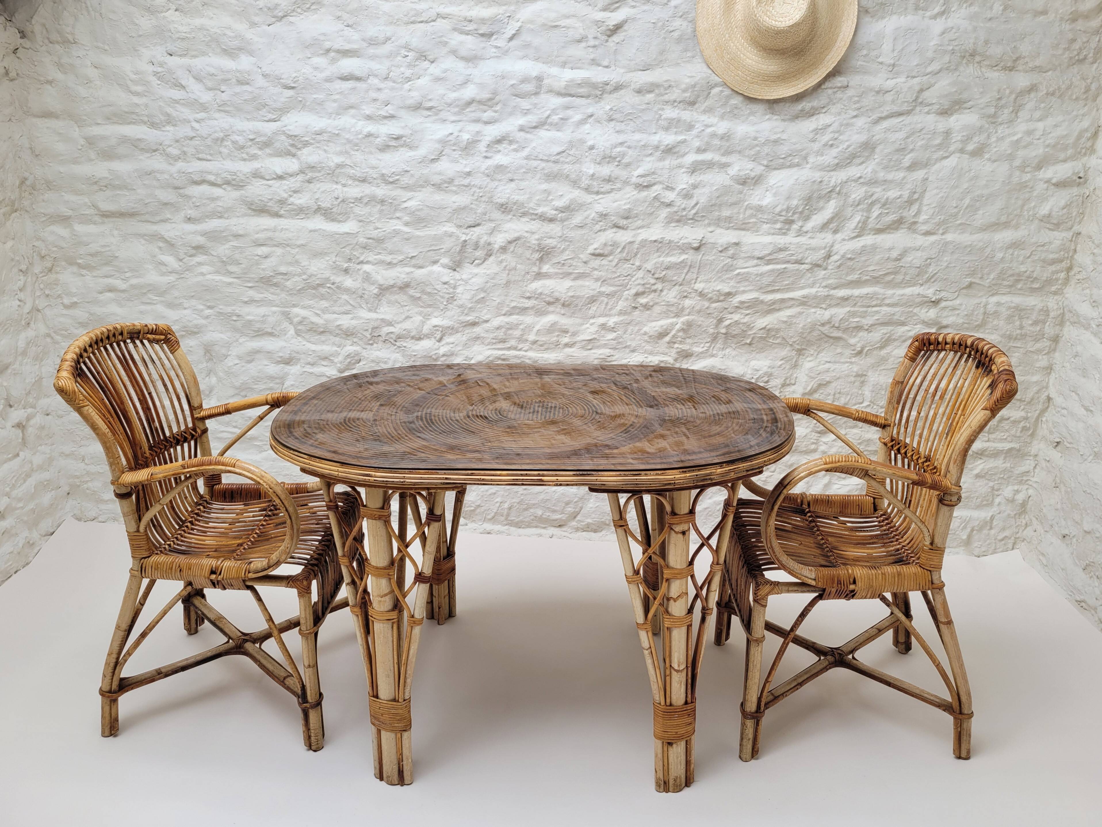 Vintage Audoux Minet bamboo, rattan, and smoked glass table duo.