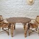 Vintage Audoux Minet bamboo, rattan, and smoked glass table duo.