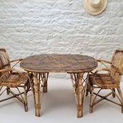 Vintage Audoux Minet bamboo, rattan, and smoked glass table duo.