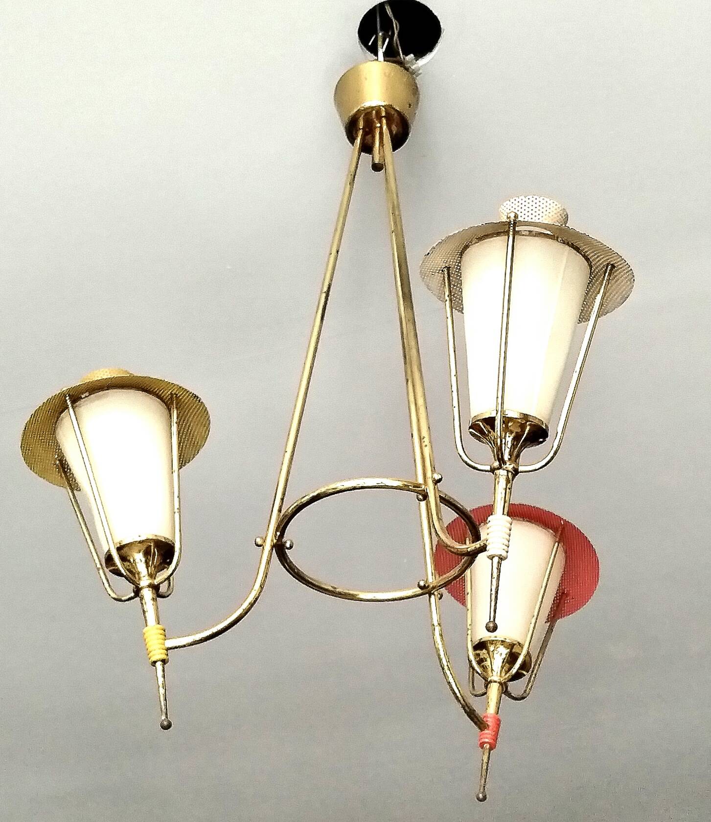 Three-arm pendant light in gilded brass and perforated metal by Maison Arlus Vintage from the 50s