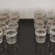 8 glasses with white granite band and gold edging from the 1950s