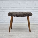 1960s, reupholstered Danish armchair, with stool, genuine sheepskin.