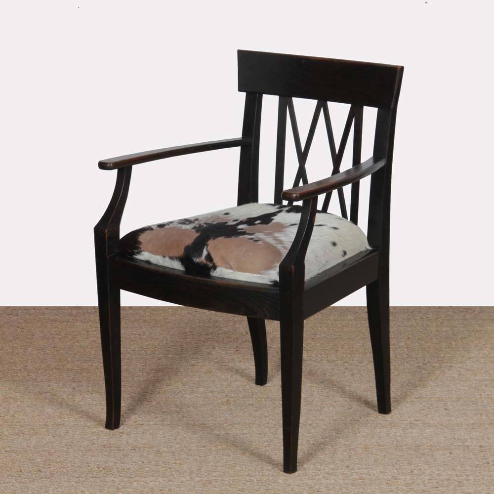 Bridge armchair in wood and leather, work from the early 20th century.