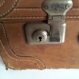 suitcase of leather with labels of palaces