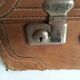 suitcase of leather with labels of palaces