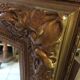 Miroir en bois doré 125 x 95 cm