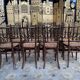Suite de 8 chaises de bistrot en cannage FISCHEL
