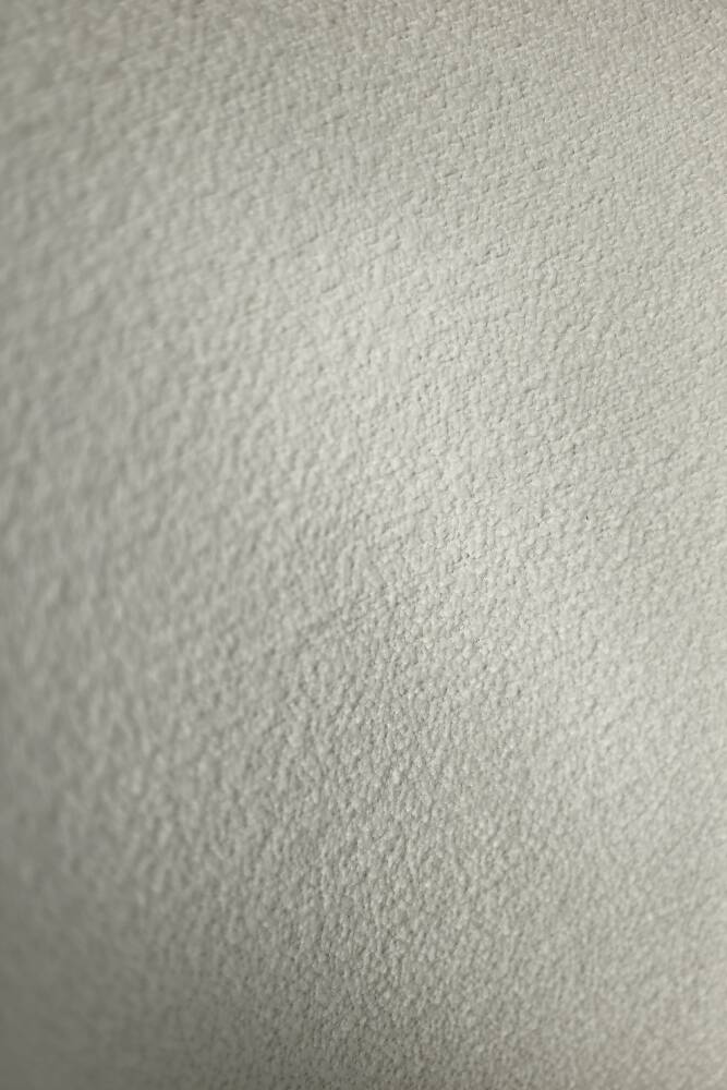 Low oak armchair with modern mid-century Scandinavian fabric and rounded backrest, 1960s.