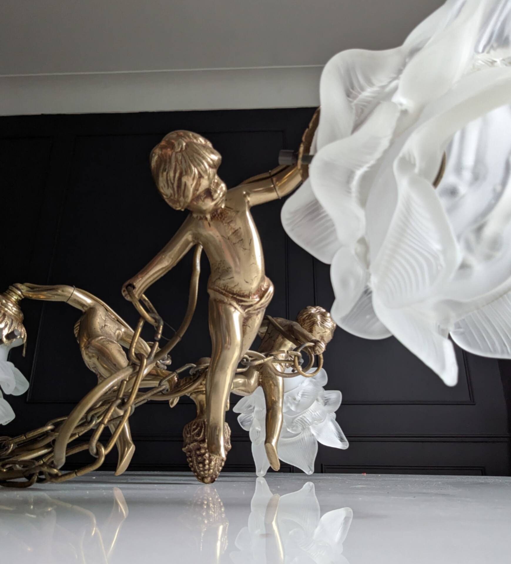 Vintage chandelier with cherubs and frosted glass flowers.