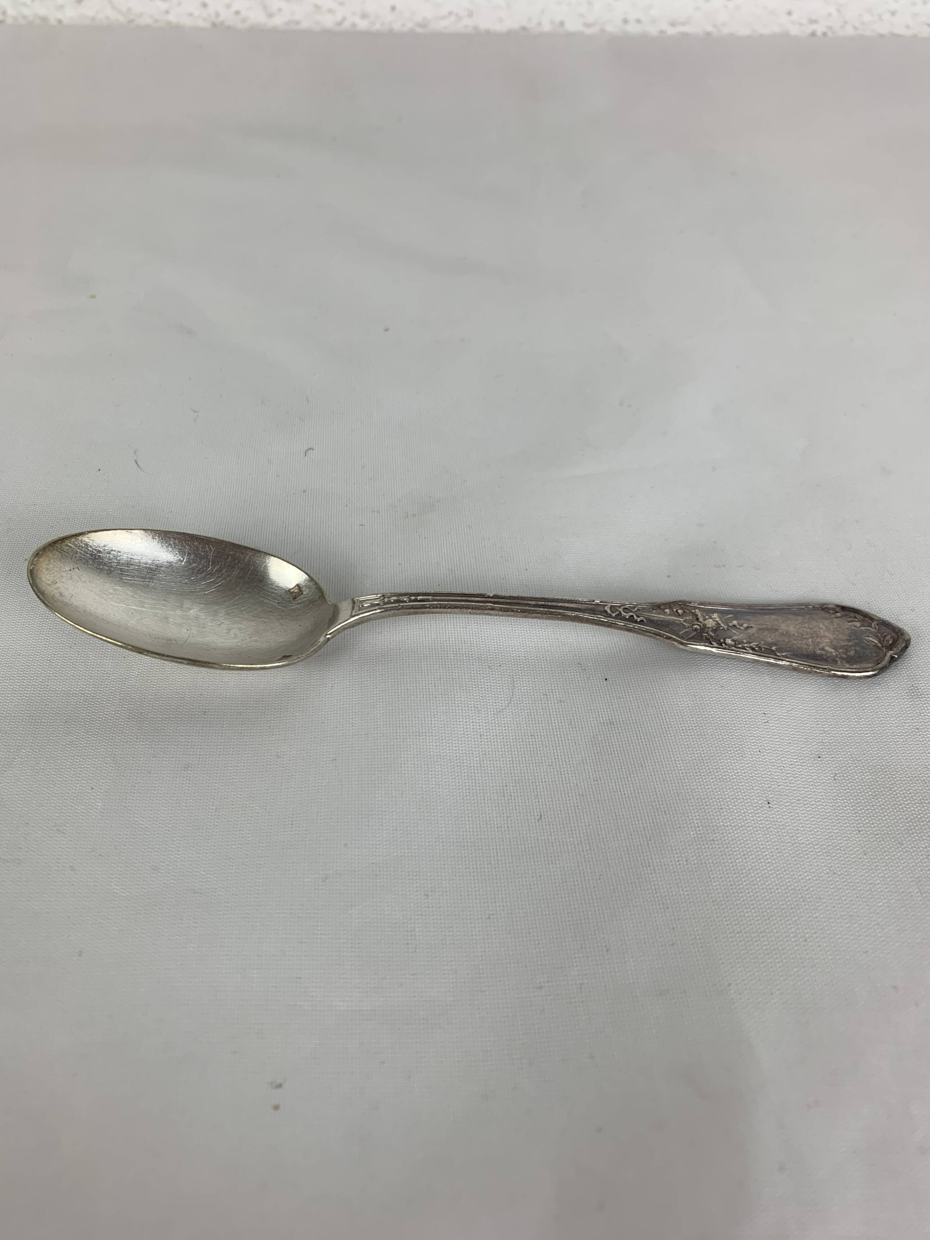 4 small silver metal spoons