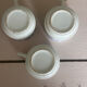 Set of 3 antique ceramic cups with blue floral pattern.