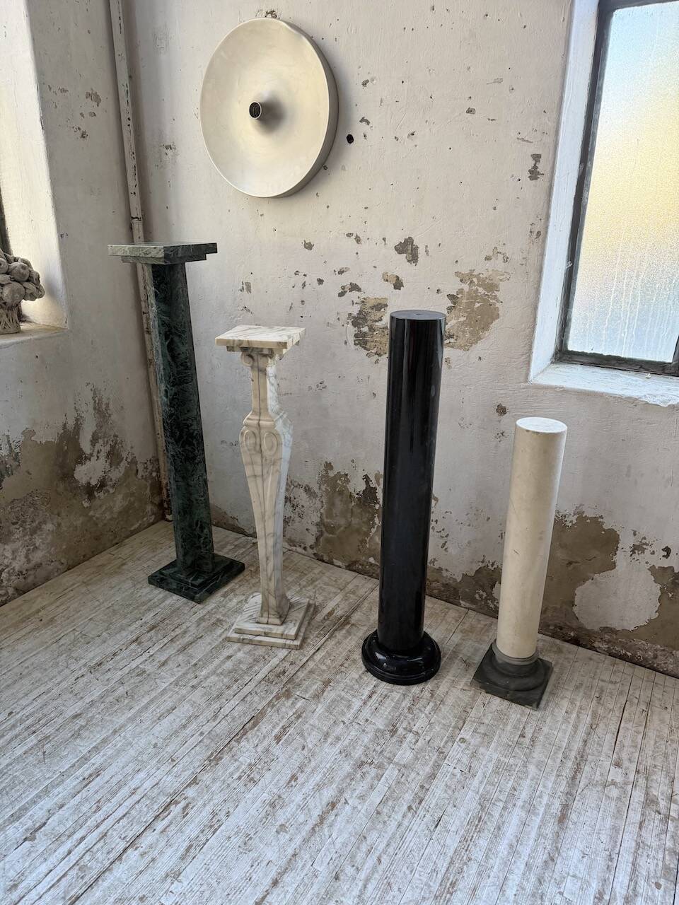 Set of 4 marble columns or pedestals.