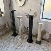 Set of 4 marble columns or pedestals.