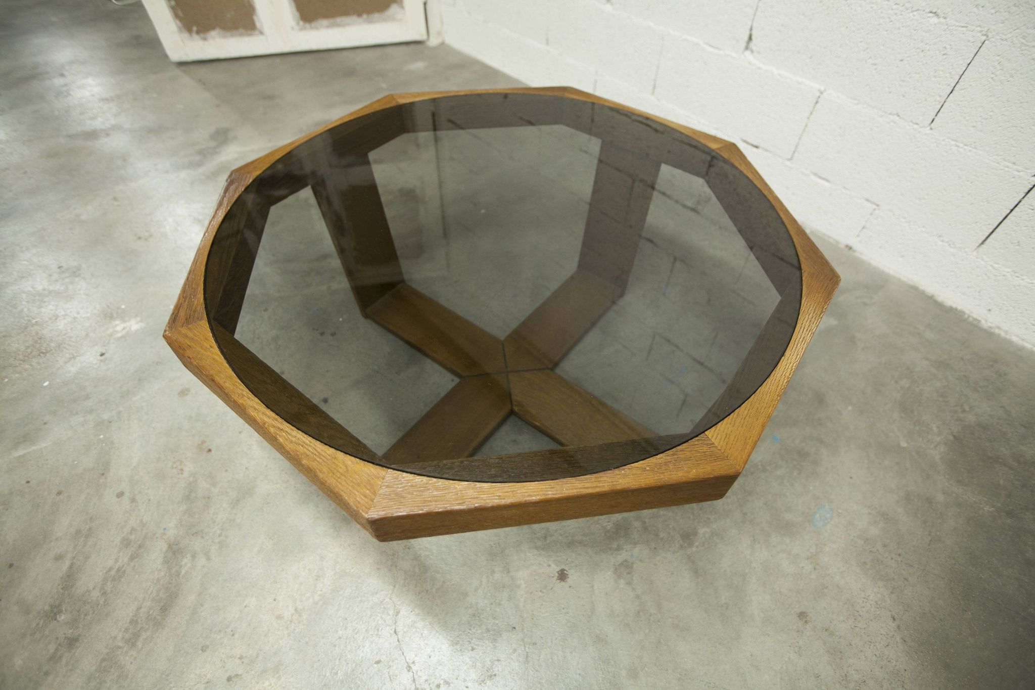 Unique hexagonal table 1977, smoked glass and oak, Swiss made.