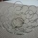 Fruit cut basket made of metal wire, ball feet