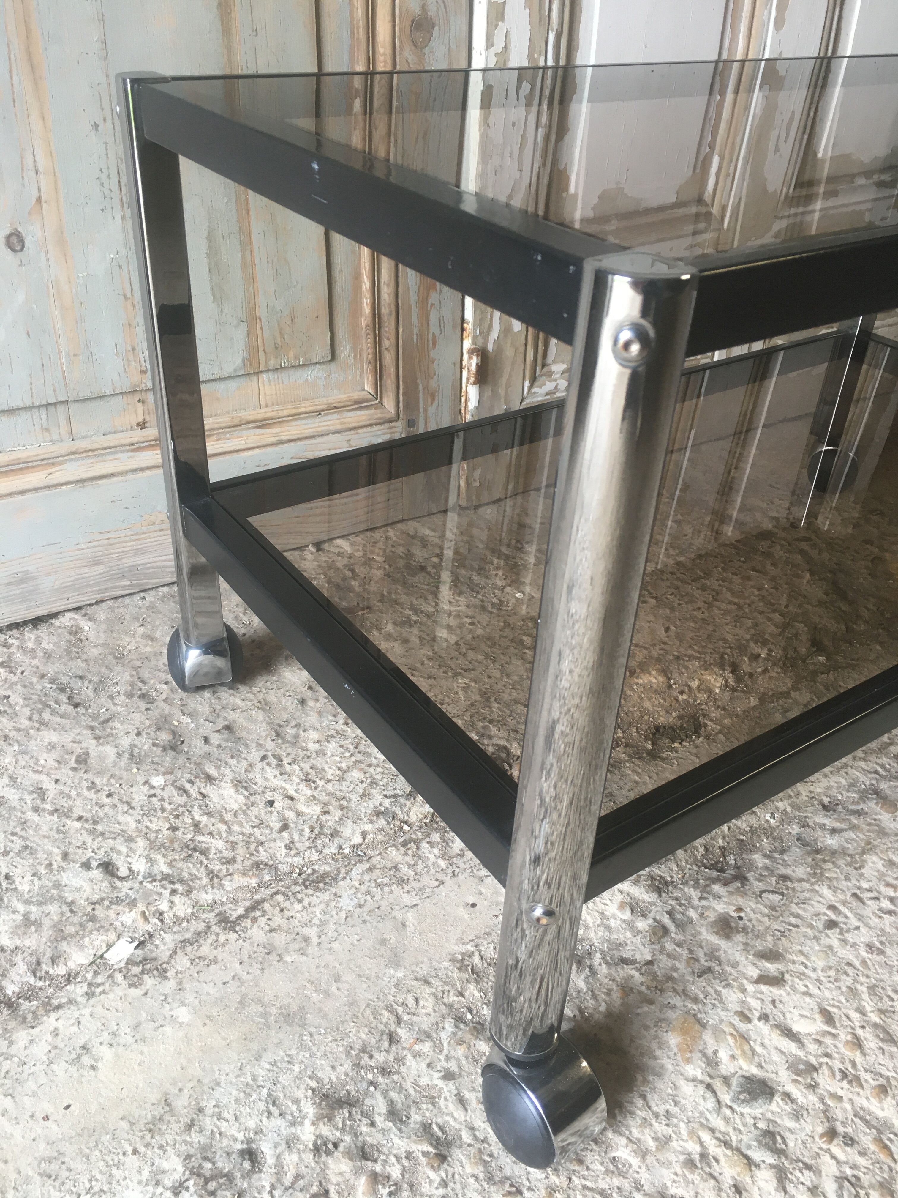 Metal coffee table with smoked glass.
