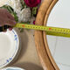 Round rattan mirror