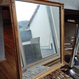 Miroir en bois, doré à la feuille d'or.