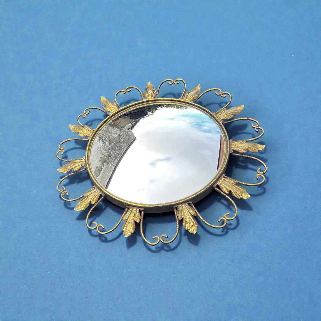 Circular gold metal mirror with floral decoration – 1960s