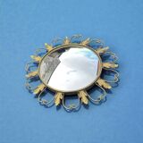 Circular gold metal mirror with floral decoration – 1960s