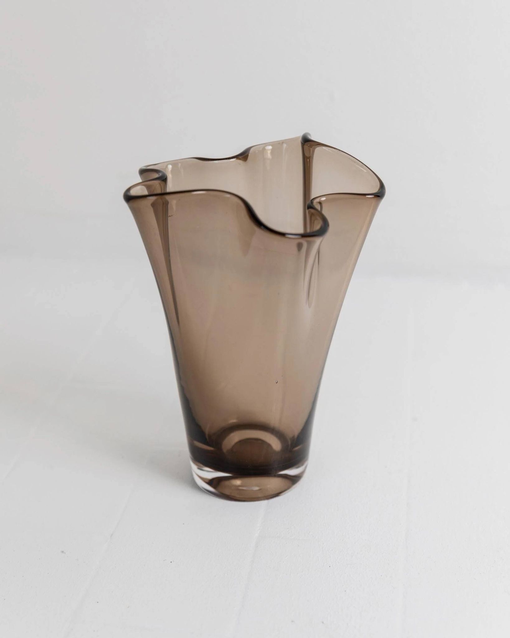 Vintage Murano glass vase from the 1980s, smoky brown, organically wavy shape.
