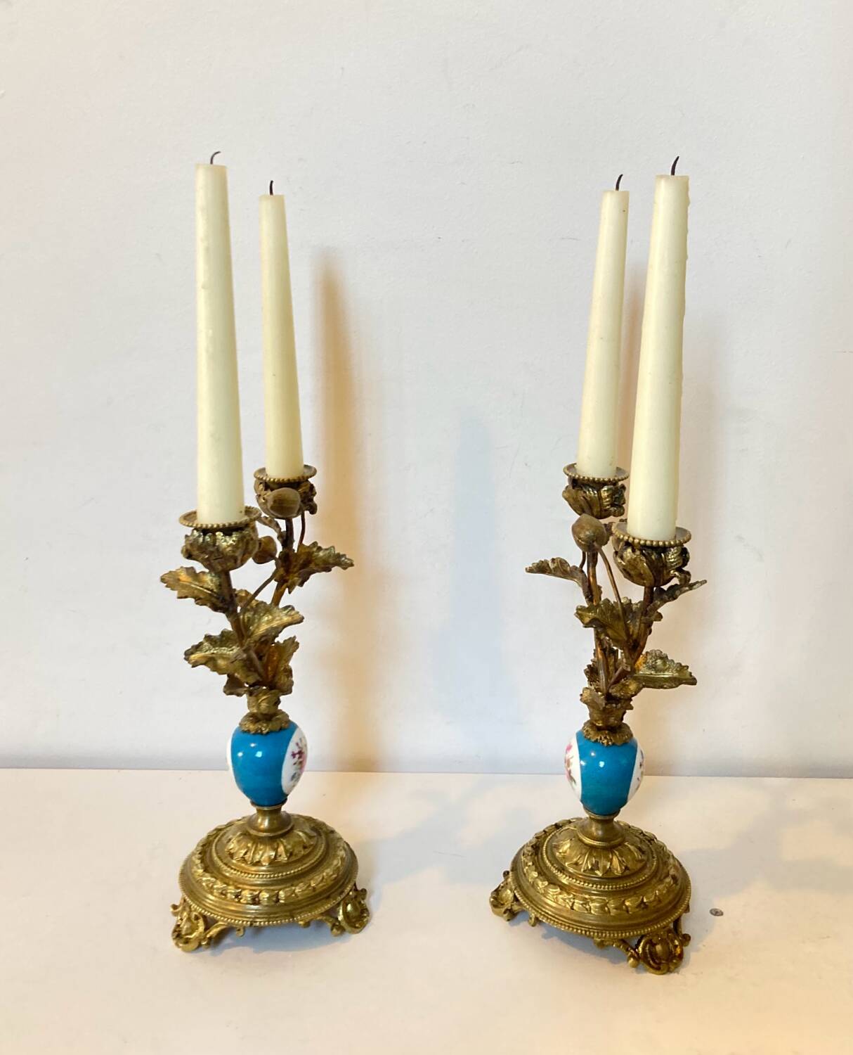 19th century candle holders in gilded bronze and porcelain