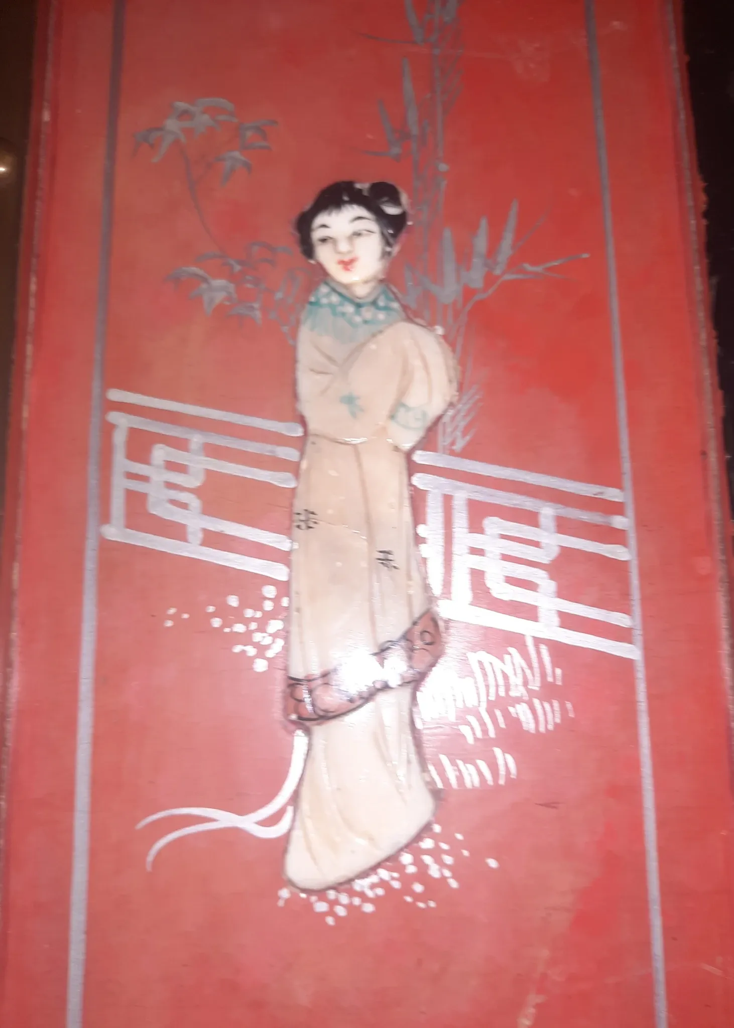 Red lacquered wooden mallet from the Far East.