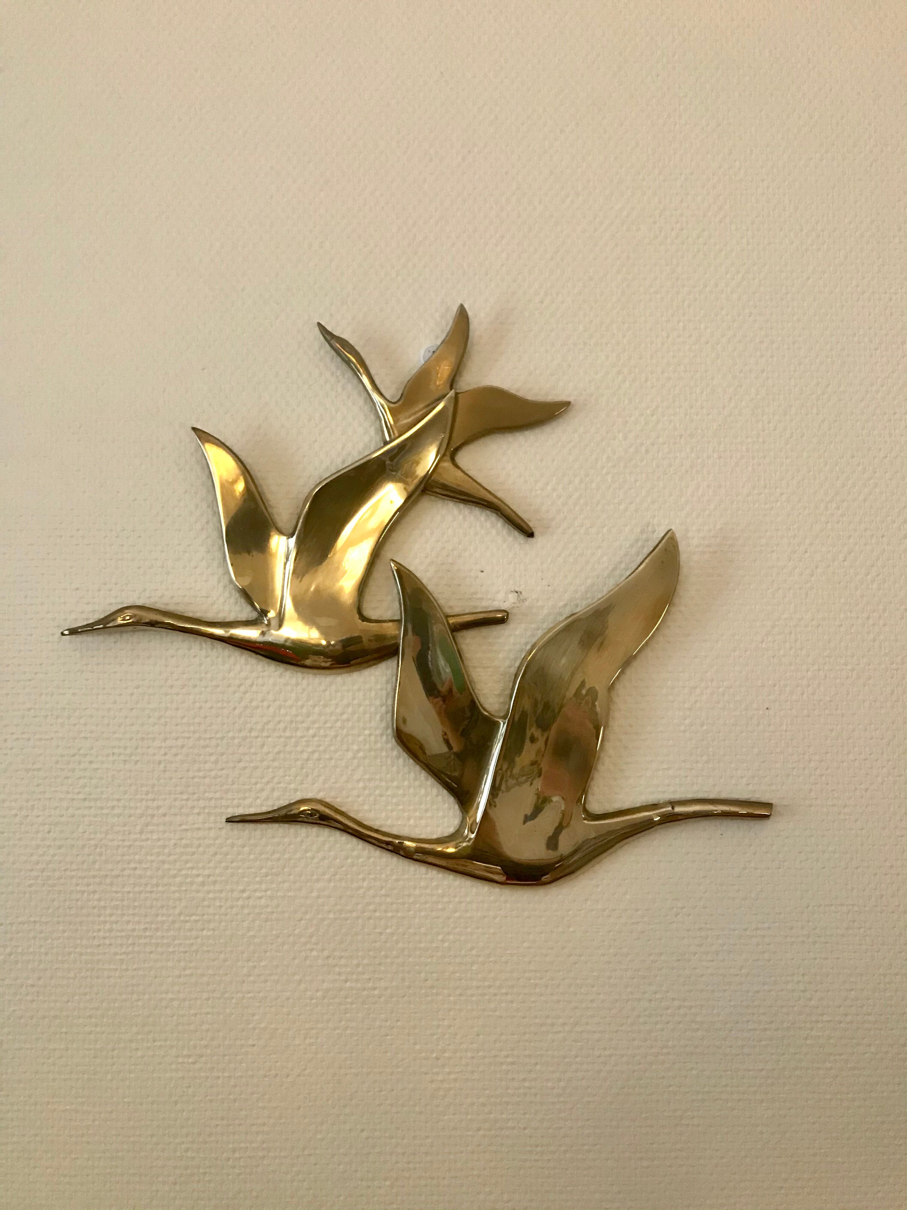 Birds in brass flight