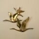 Birds in brass flight