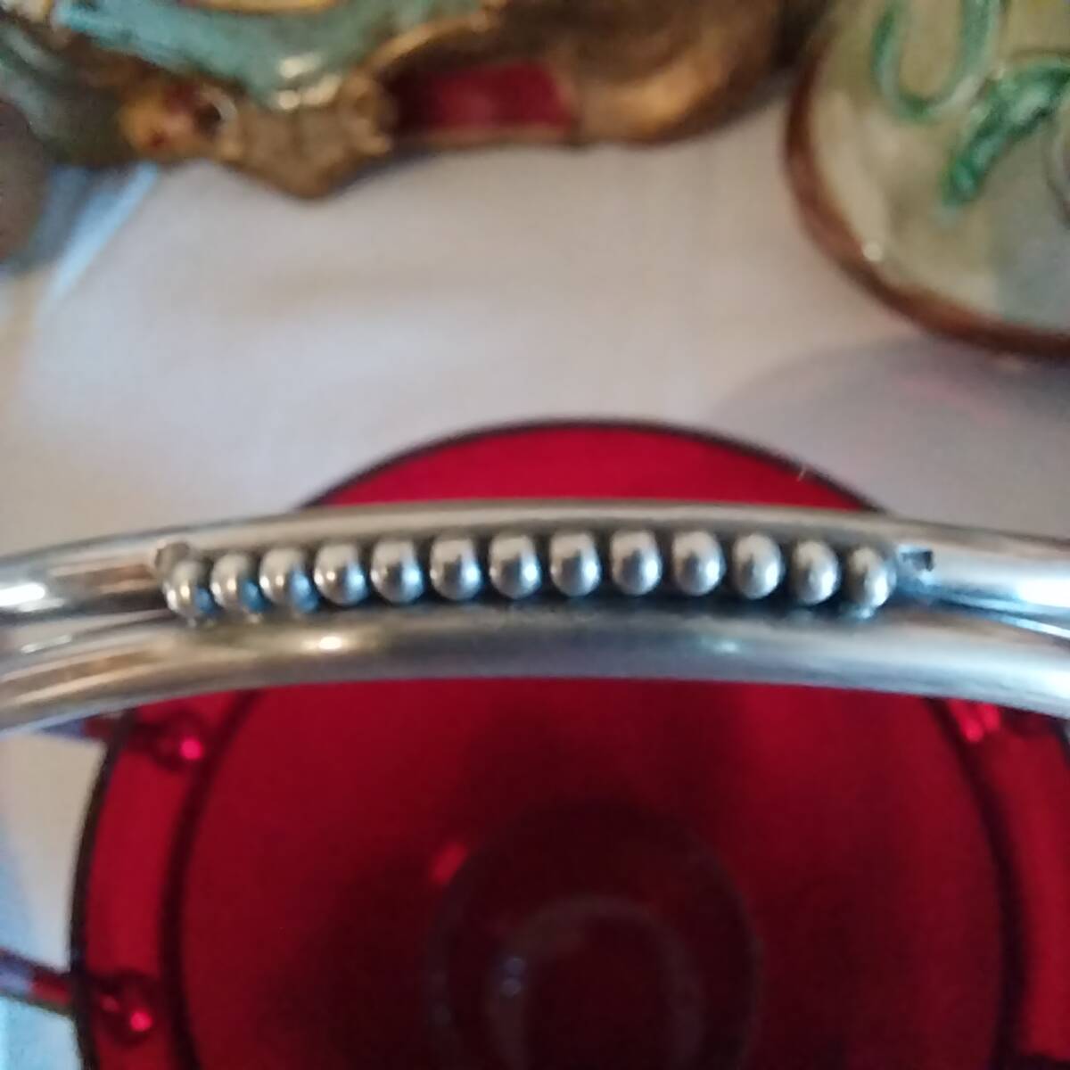 Vintage crystal ice bucket with silver-plated handle.