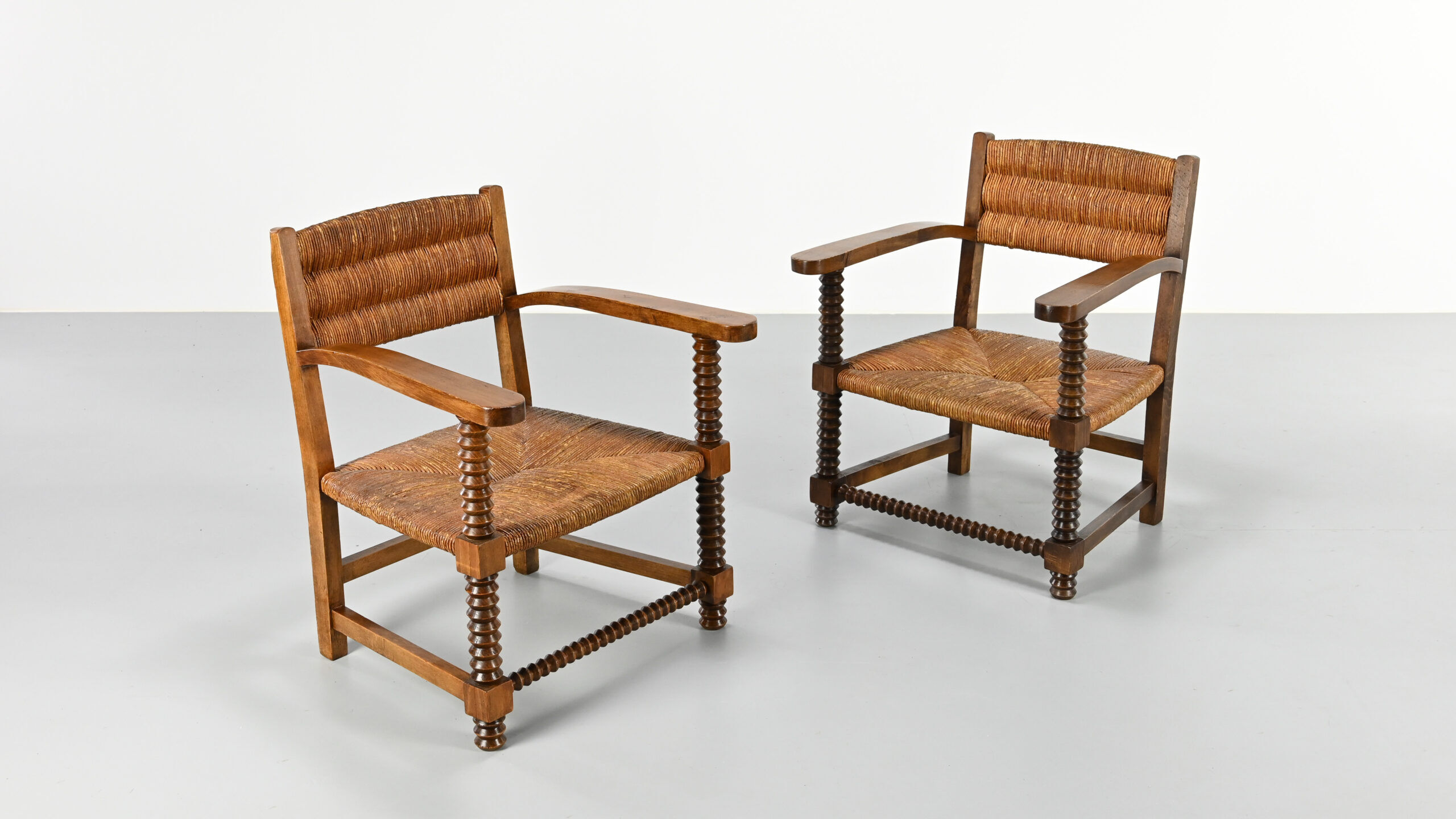 Pair of French armchairs with twisted legs in the style of Charles Dudouyt, France, 1940s.