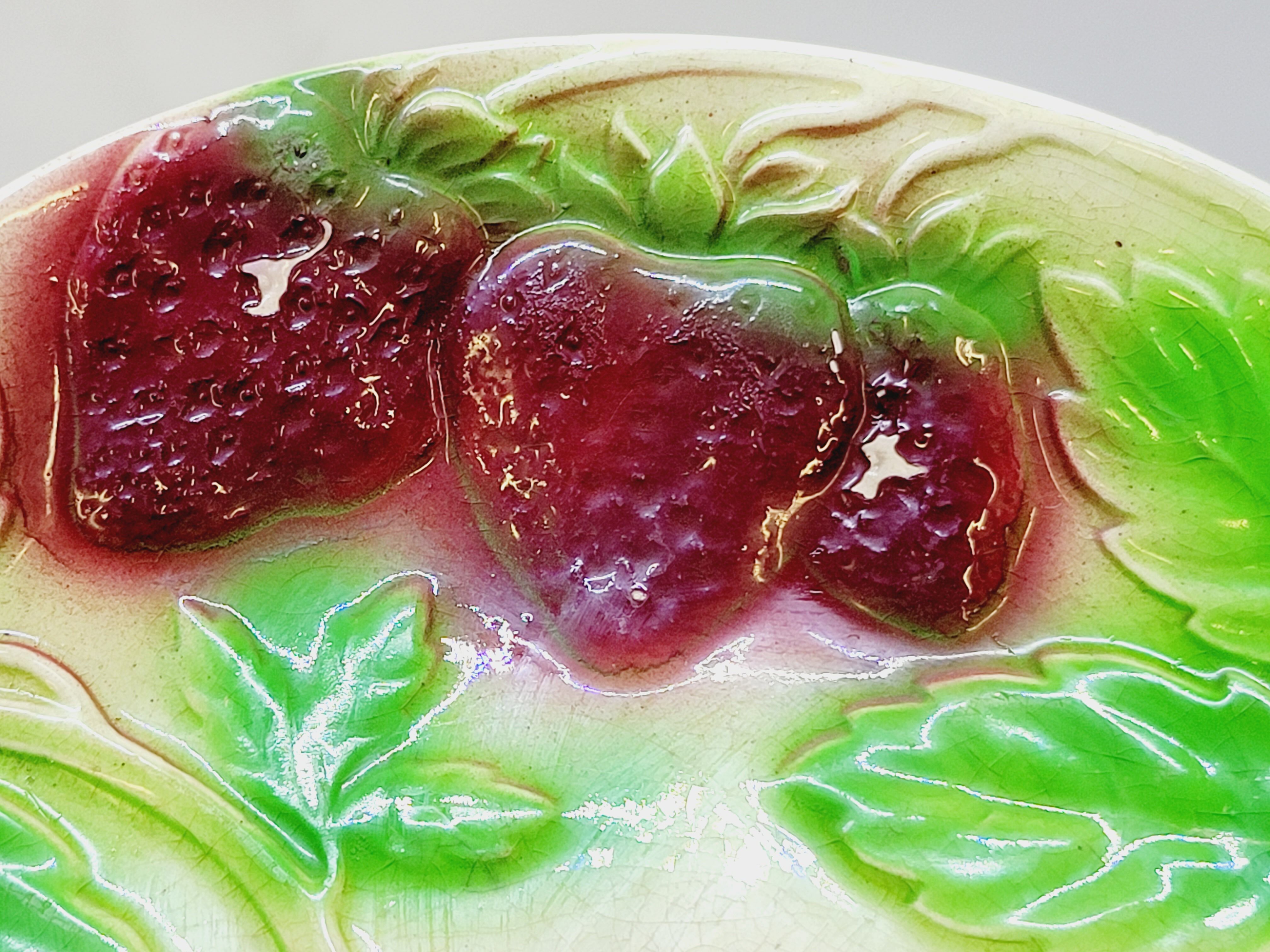 3 old plates in slip decoration strawberries and grapes