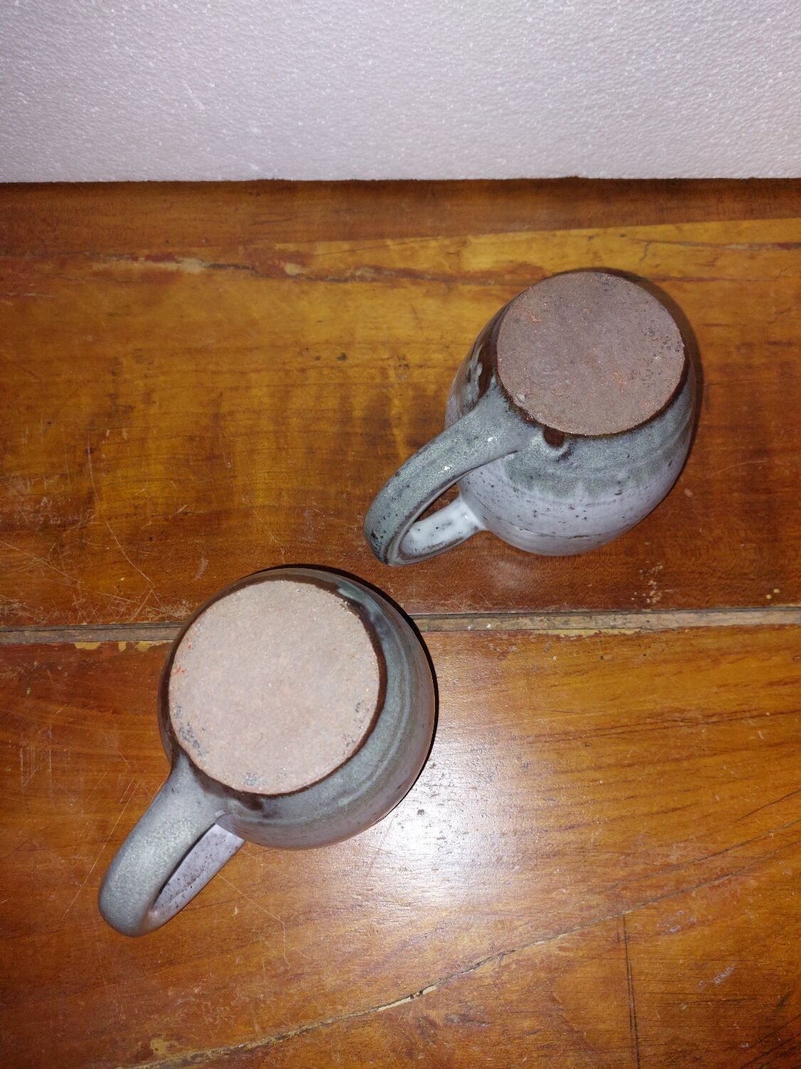 Two glazed stoneware mugs