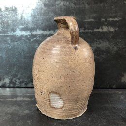 Old varnished sandstone jug